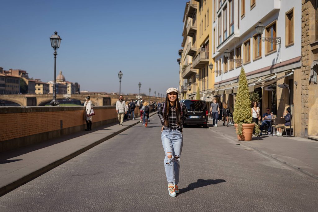 Teen walking near Ponte Vecchio in Florence Italy